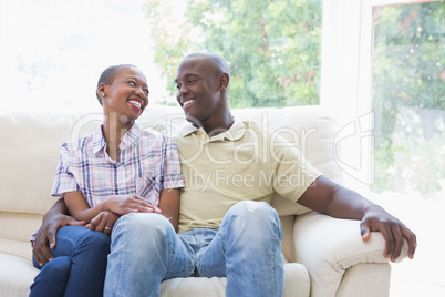 Happy smiling couple on the couch