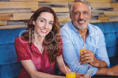 Cute couple sitting in cafe