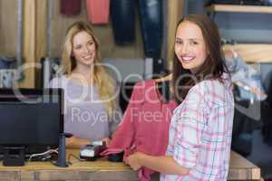 Pretty brunette doing shopping and smiling at camera