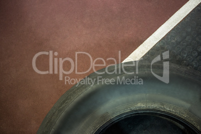 Close up view of tire next to race track