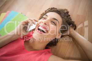 Young creative businesswoman laughing on the phone