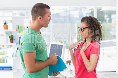 Casual business team looking at files Casual business team looking at files