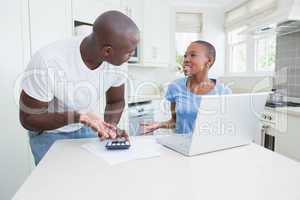 A couple working and using laptop