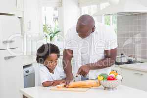 Little boy cooking with his father