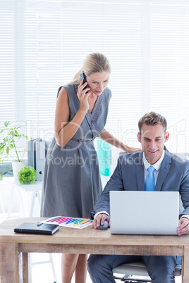 Business people working together on laptop