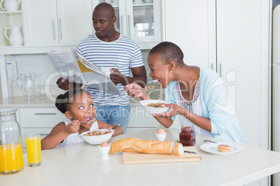 Happy family sitting and taking breakfast Happy family sitting and taking breakfast