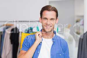 Portrait of a smiling man with shopping bags