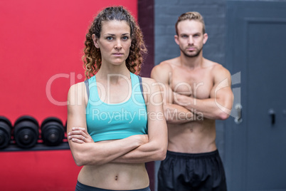 Serious muscular couple looking at the camera