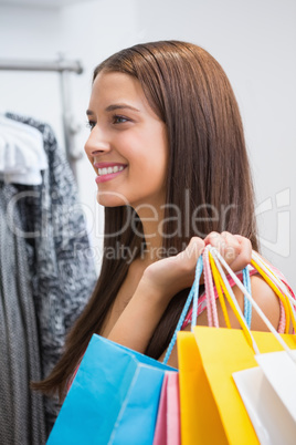 Smiling woman with shopping bags