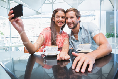 Young happy couple making a selfie