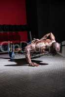 Young Bodybuilder doing One-armed push ups