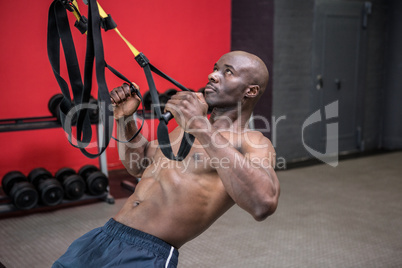 Young bodybuilder doing excercises