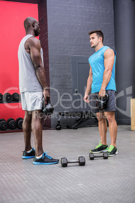 Two young Bodybuilder looking at each other