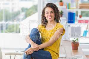 Smiling young businesswoman looking at the camera