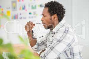 Concentrated casual businessman working with computer