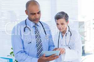 Medical colleagues working with tablet computer