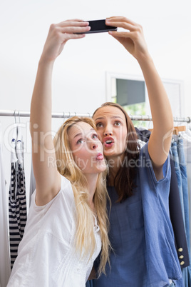 Happy smiling friends taking a selfie