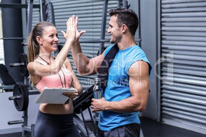 A female coach giving high five