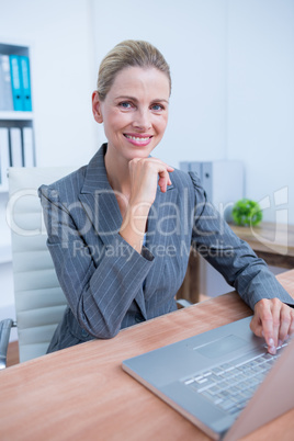 Pretty blonde businesswoman using her laptop Pretty blonde businesswoman using her laptop