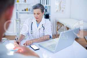 Female doctor speaking with her patient