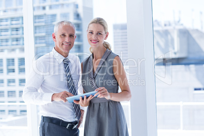 Business people discussing over a digital tablet