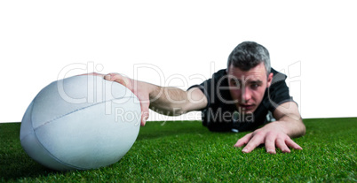 A rugby player scoring a try