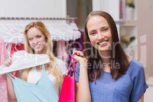 Happy friends doing shopping together