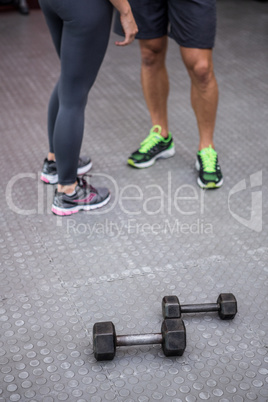 Two young bodybuilders standing next to each other