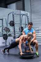 Young bodybuilder training with a young woman