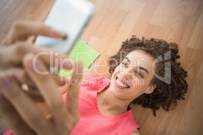 Young creative businesswoman taking a selfie