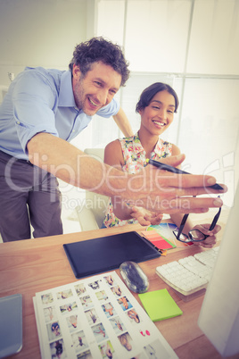 smiling casual young couple at work