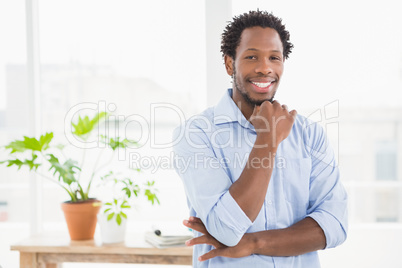 Young smiling businessman looking at the camera