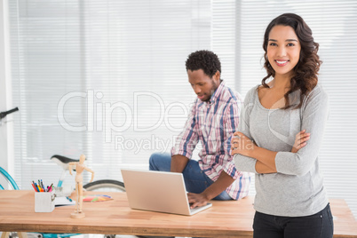 Young business people smiling at the camera