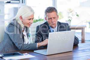 Business people working on laptop computer