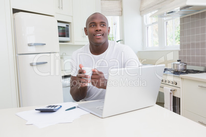 A man working and using his laptop