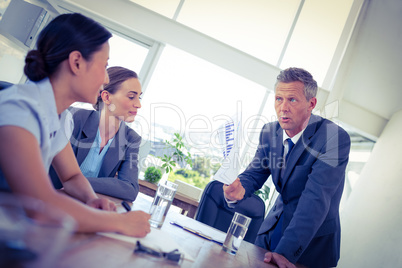 Businessman showing documents during meeting