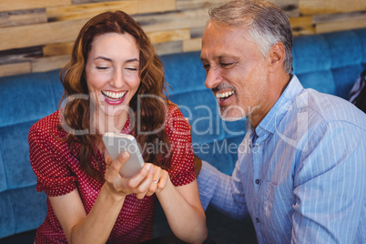 cute couple looking at their phones