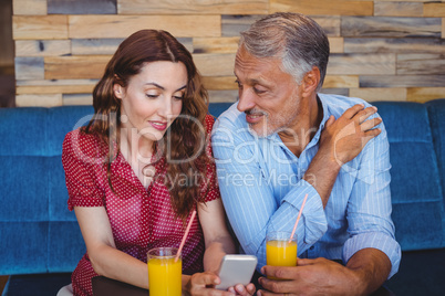 Cute couple sitting in cafe