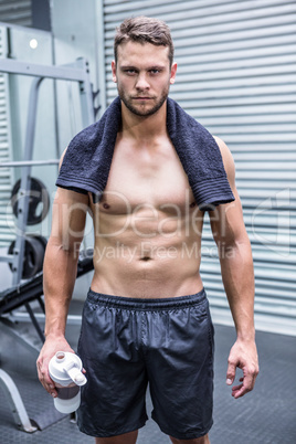 Portrait of muscular man looking at camera