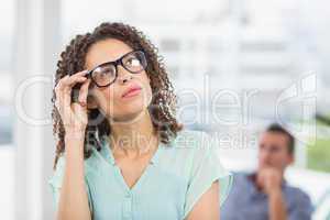 Young businessman looking away in the office