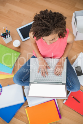 Young creative businesswoman working on laptop