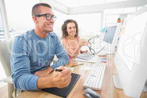 Concentrated coworkers using laptop and digitizer