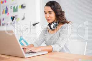 Young businesswoman looking at the laptop