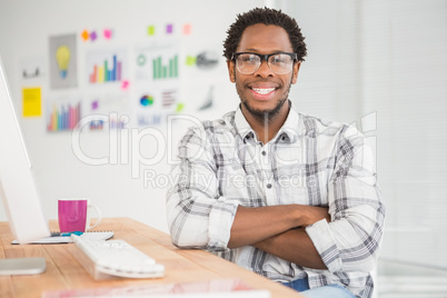 Young businessman smiling at the camera