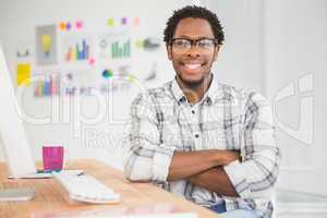 Young businessman smiling at the camera