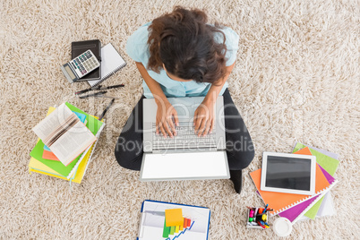 Young businesswoman typing on the laptop