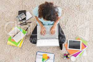 Young businesswoman typing on the laptop