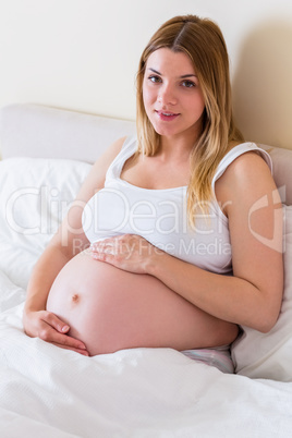 Pregnant woman looking at camera