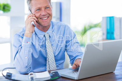 Serious businessman having phone call Serious businessman having phone call