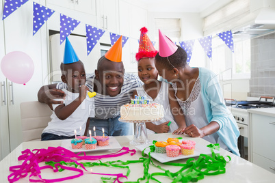 Happy family celebrating a birthday together